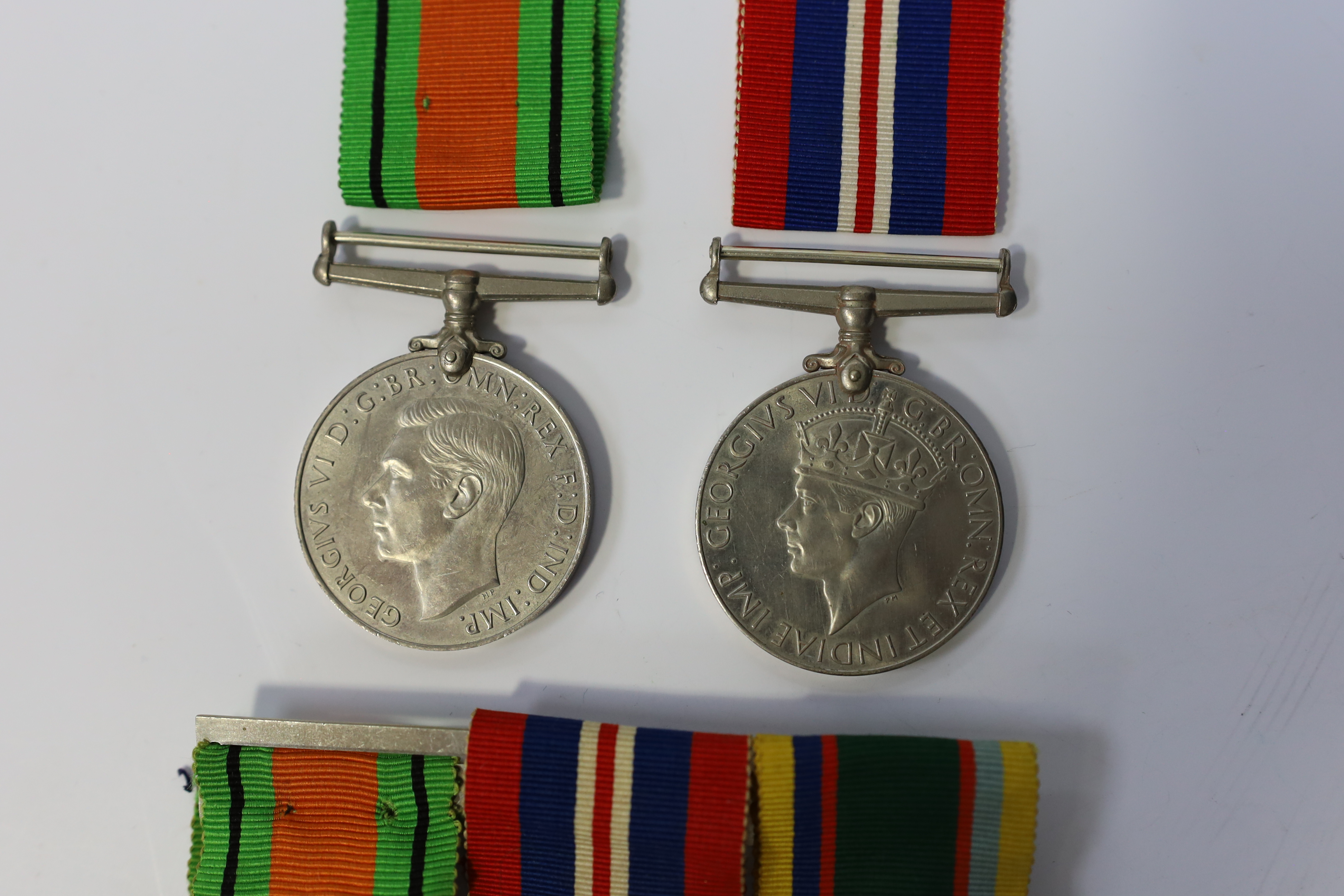 A group of assorted medals; WW2/ERII Cadet Forces medal group of 3 with two clasps to Fg.Off.W.K.Winstone R.A.F.V.R.(T); ERII RAFLSGC to Cpl B.K.Stockwell (F2570477) in box; WW2 Dm & WM. Condition - fair to good.